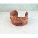 Very rustic fold formed copper cuff bracelet with braille "I am enough" Contracted Grade 2 Braille Perkins E-Z Read Slate.